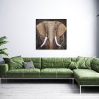 Stylish interior of bright living room with green sofa and plant